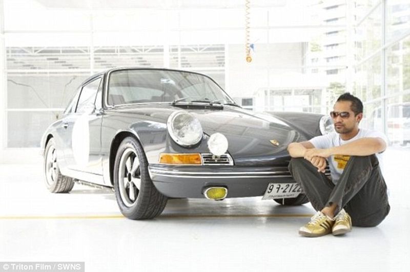 Thai man builds glass elevator in lounge to display his Porsche cars