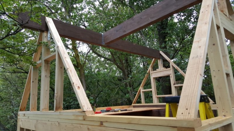 This DIY built mini treehouse in Western US features a slide for kids