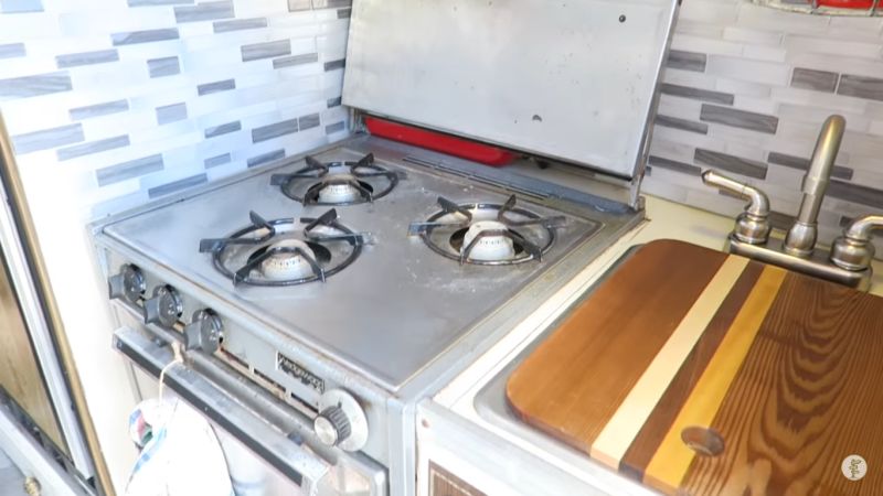 Kitchen has cool oven and stovetop 