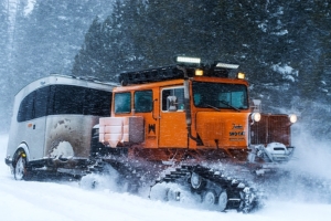 Airstream Basecamp paired with Sno-Cat for extreme snowboarding