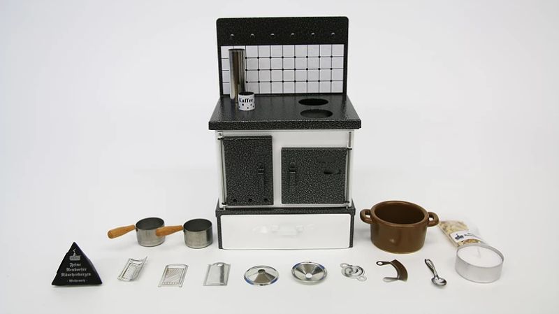 Complete miniature kitchen with tiny utensils and other tools 