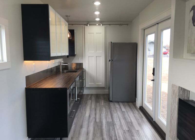 Intellectual shipping container Tiny Home by Roostspace - kitchen area 