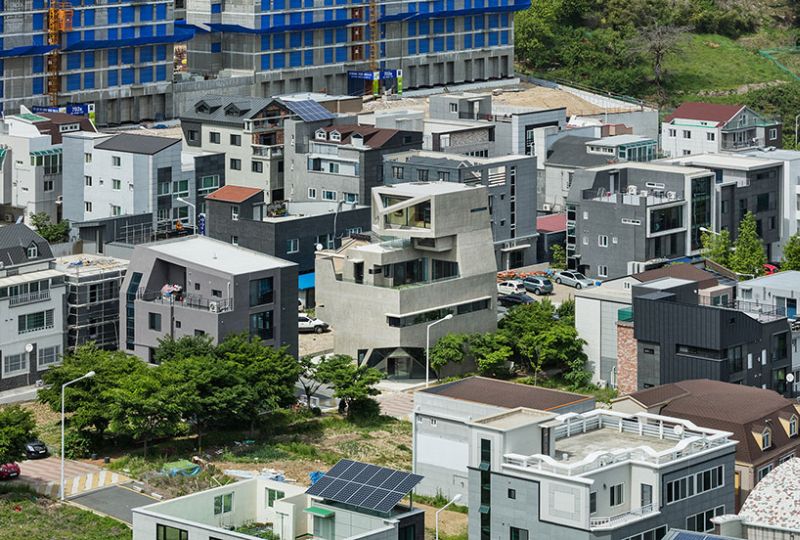 Moon Hoon builds angled concrete house in shape of an owl 