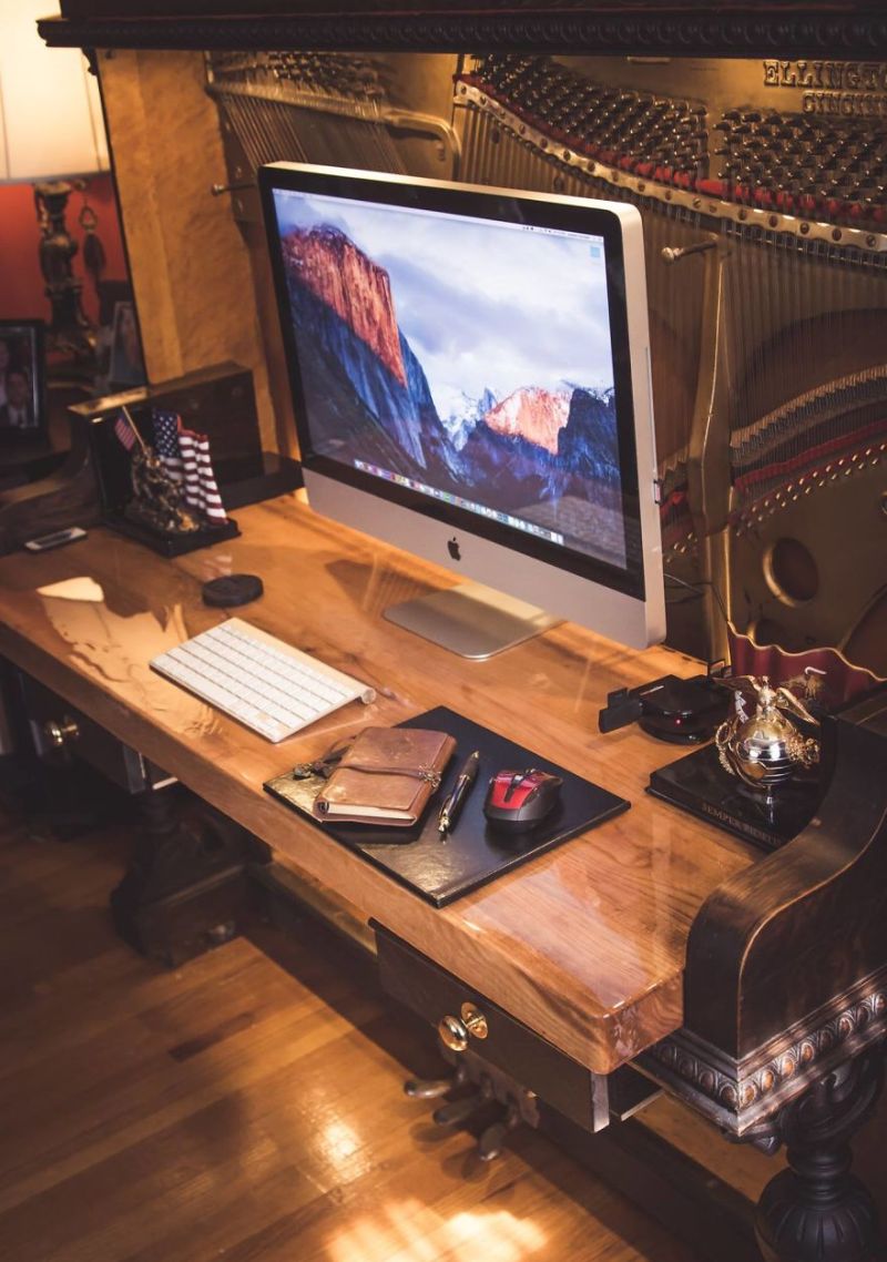 This guy repurposed old piano into DIY piano desk 