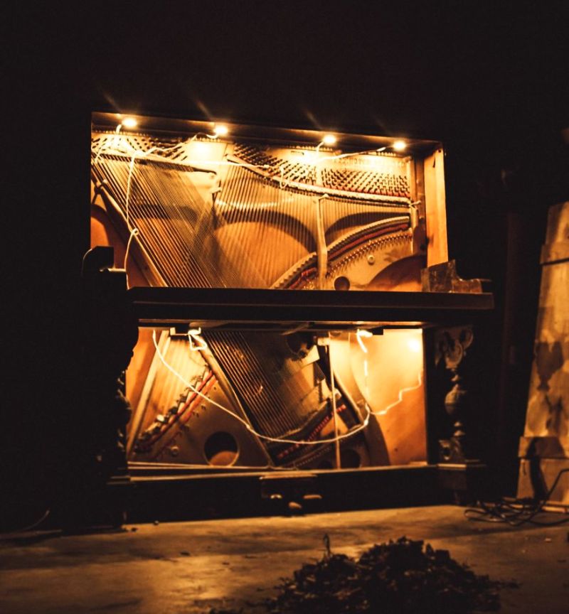 This guy repurposed old piano into DIY piano desk 