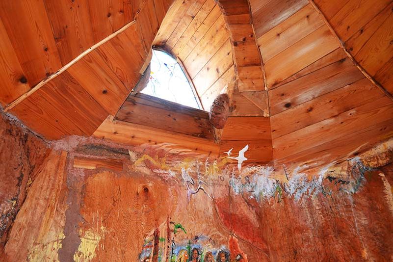 Real-life hobbit house built out of a single tree trunk 