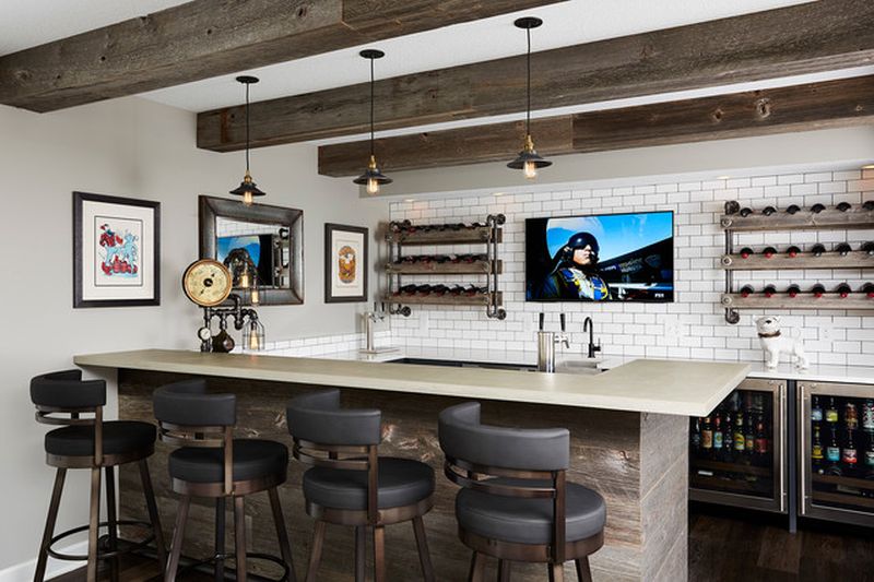 This remodeled basement features home theater and a steampunk bar 