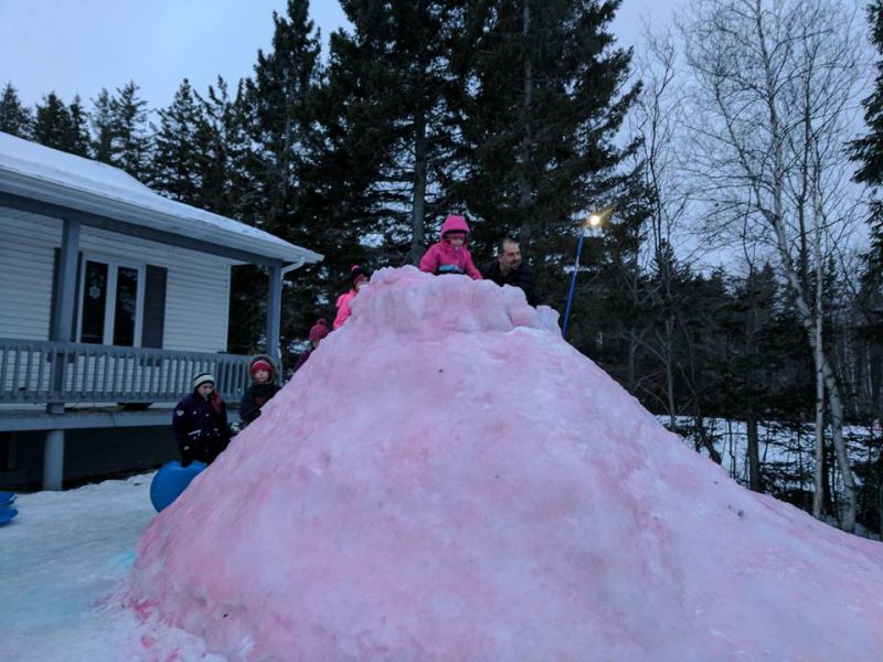 This snaking ice slide by Tracadie dad is colorful attraction for the entire neighborhood 