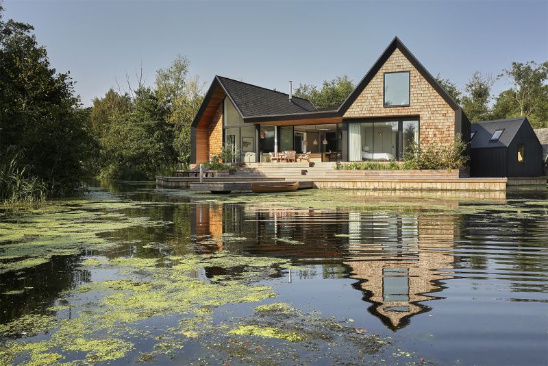 Backwater is a waterside house located across a private lagoon 