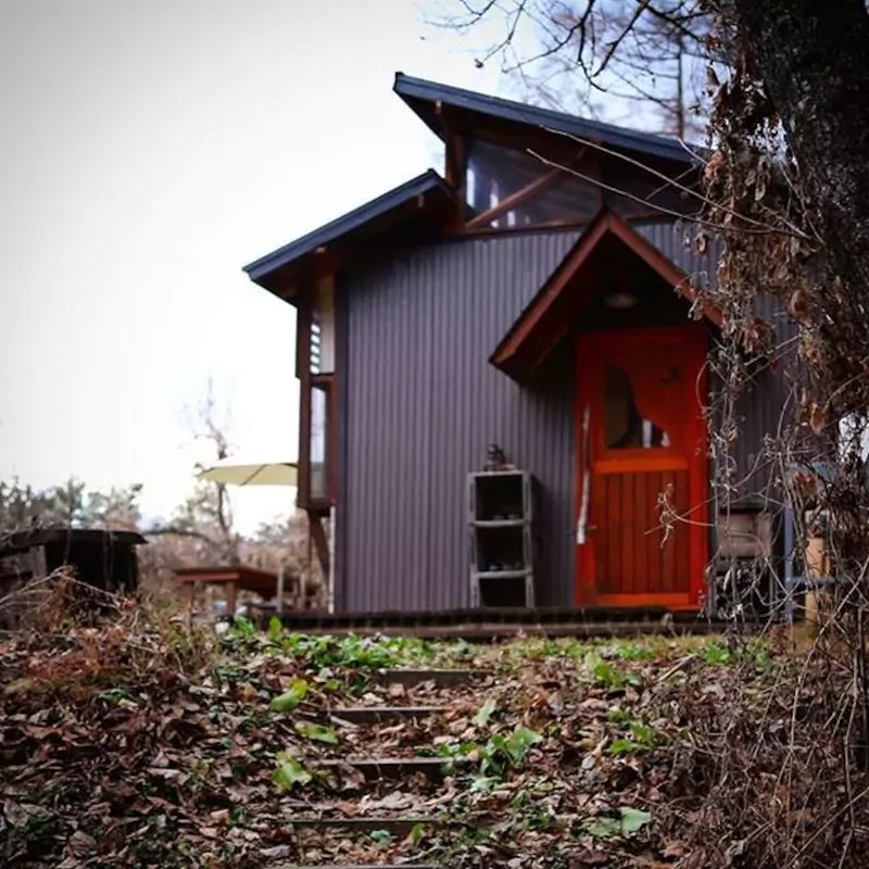 Daigo designs tiny off-grid cabin in Japanese woods 