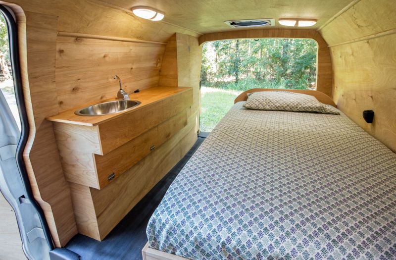 Ross Lukeman transforms cargo van into cozy home with office 