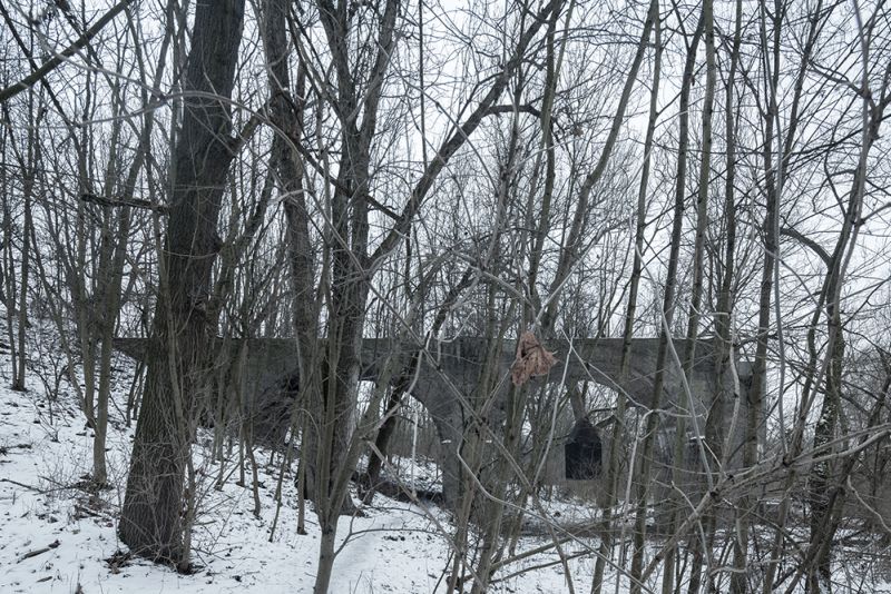 Take a tour of mysterious tiny house floating under an old railway bridge