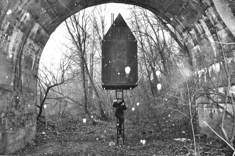 Take a tour of mysterious tiny house floating under an old railway bridge