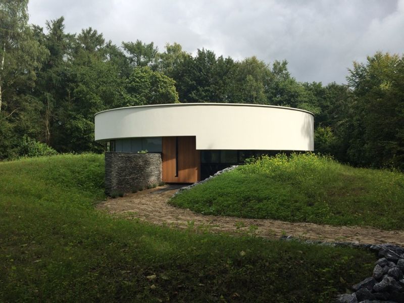 This circular house with big windows brings the outdoors in