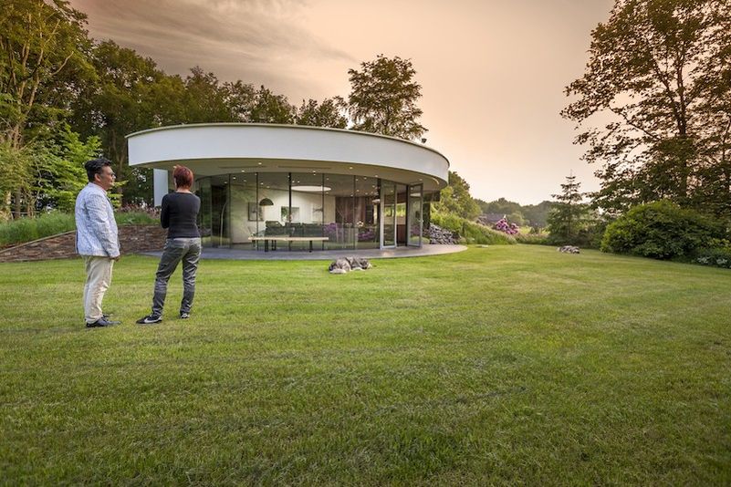 This circular house with big windows brings the outdoors in