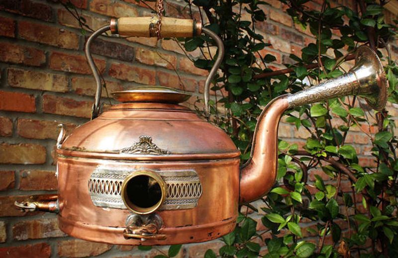 Bird home crafted from vintage copper kettle teapot and clock