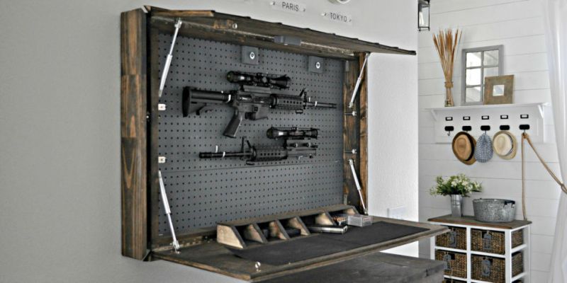 bed with secret gun safe in its headboard