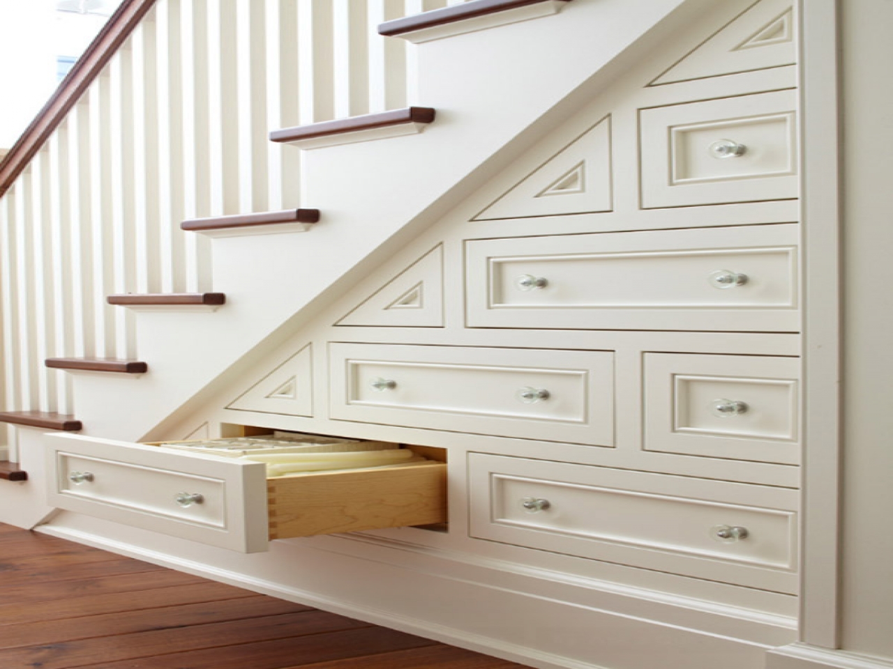 Cabinets And Drawers Under The Stairs Add Much Needed Storage Space To This  Small Apartment