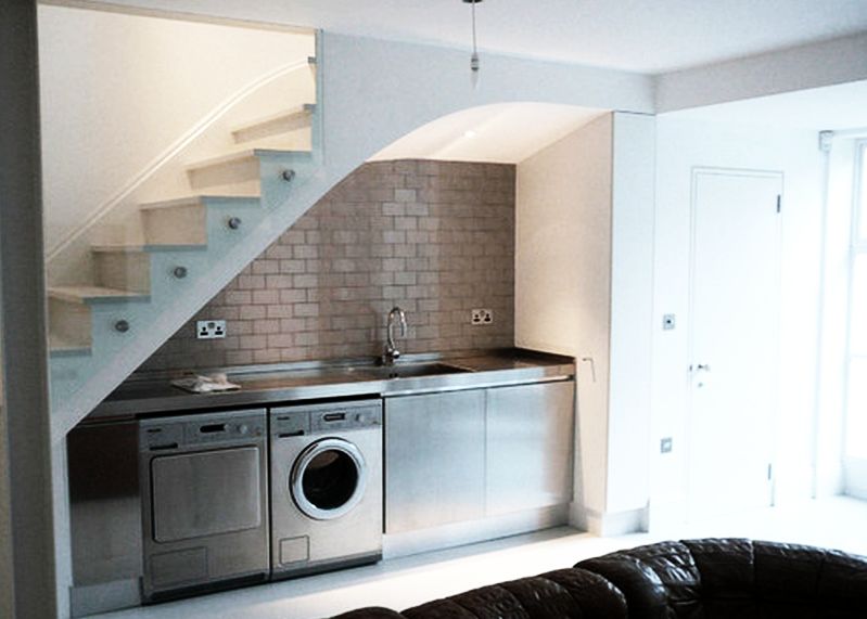 laundry area under the stairs