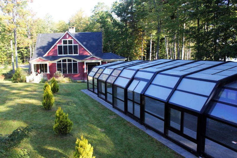 Libart retractable swimming pool roof for a house in picturesque Casco Bay