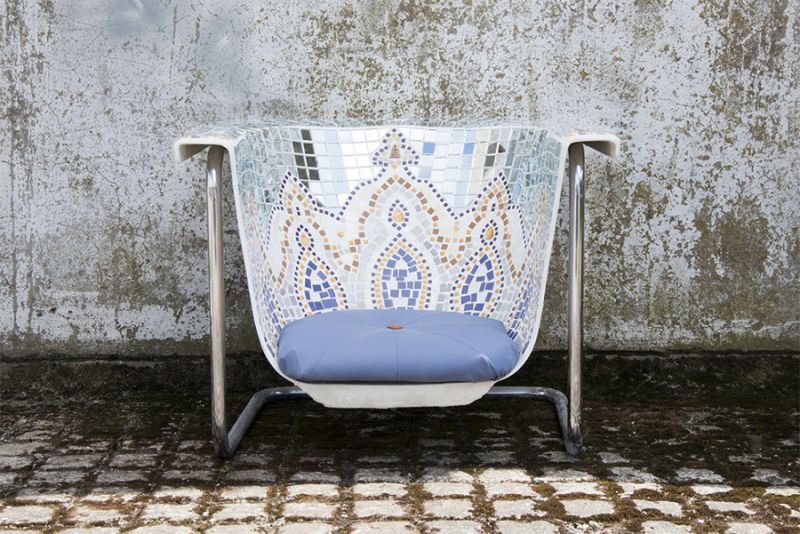 Old bathtub turned a chair with a steel frame