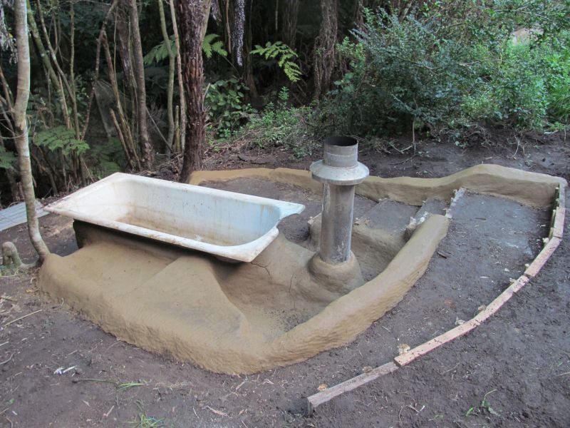 Old bathtub into hot tub on earth 