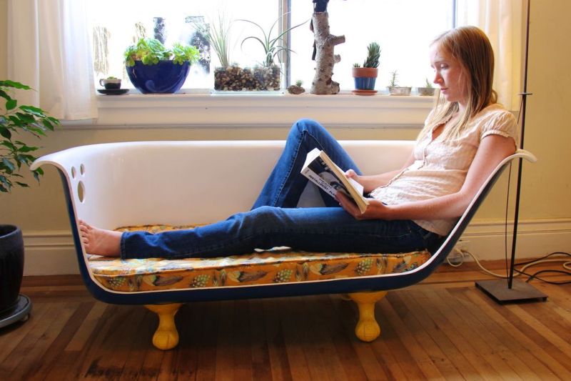 Old bathtub repurposed as a sofa