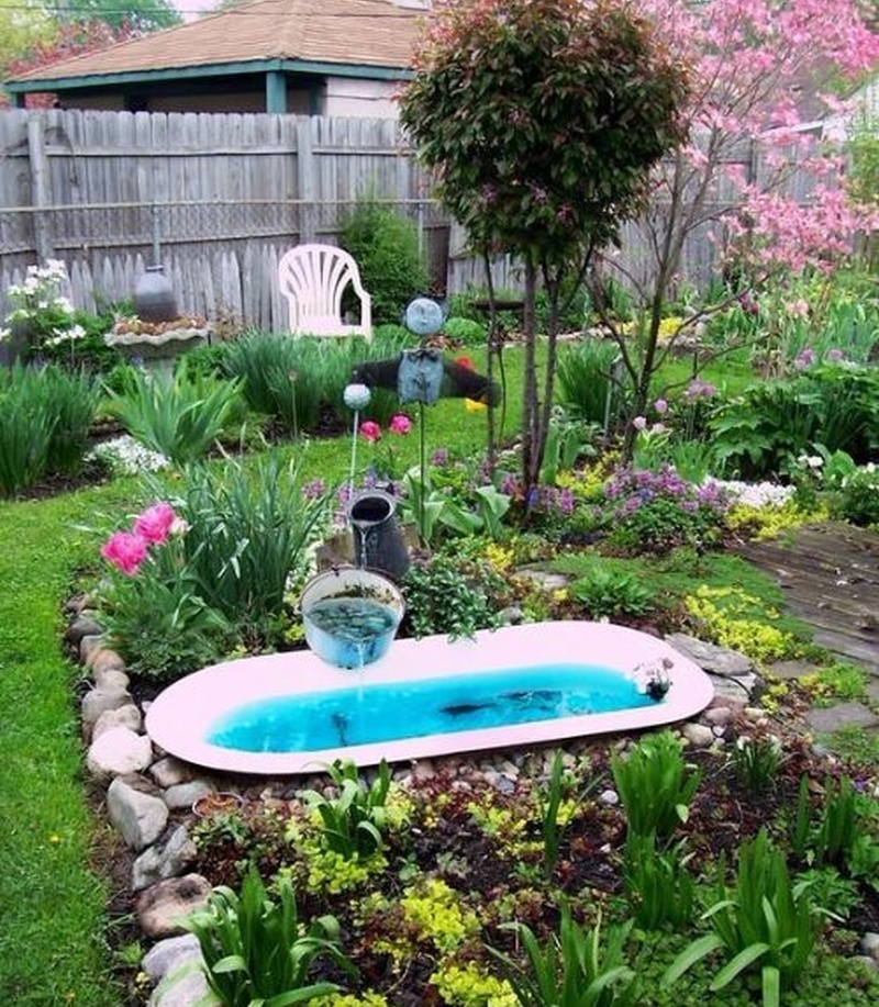 Old Bathtub turned into pond with fountain  