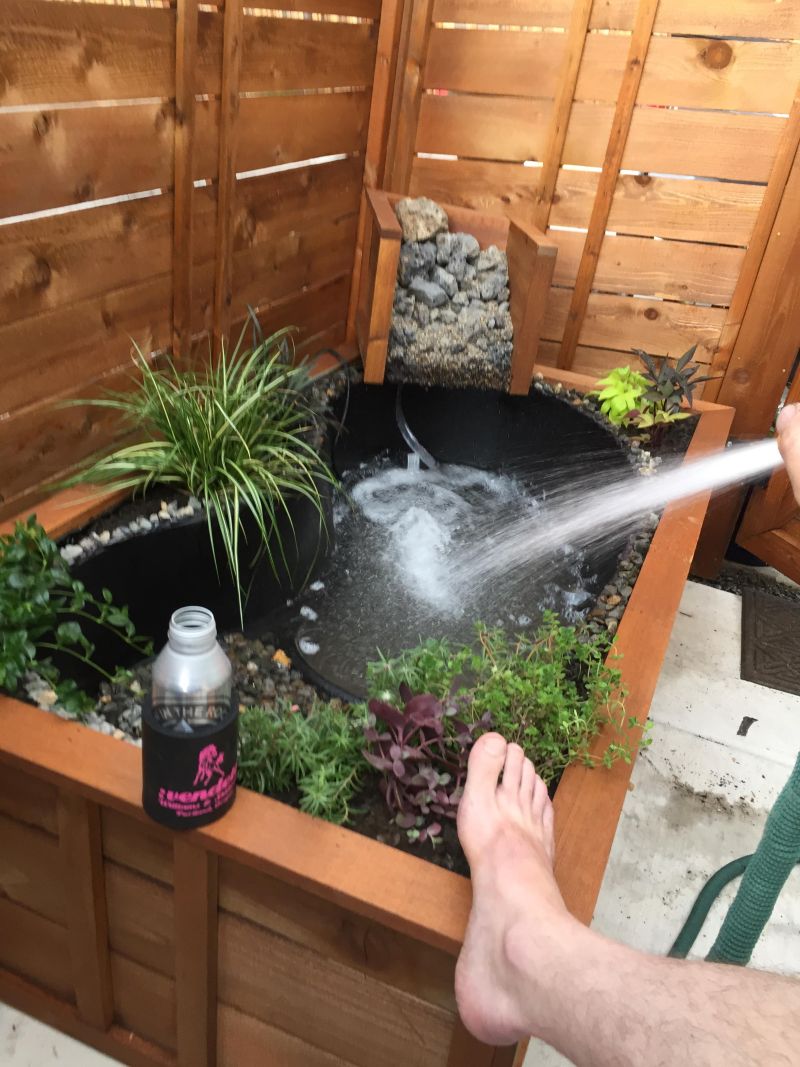 turn old bathtub into a natural-looking pond