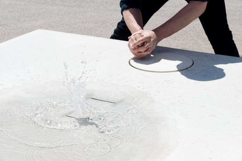 Jean Couvreur’s concrete public bench features real water surface 