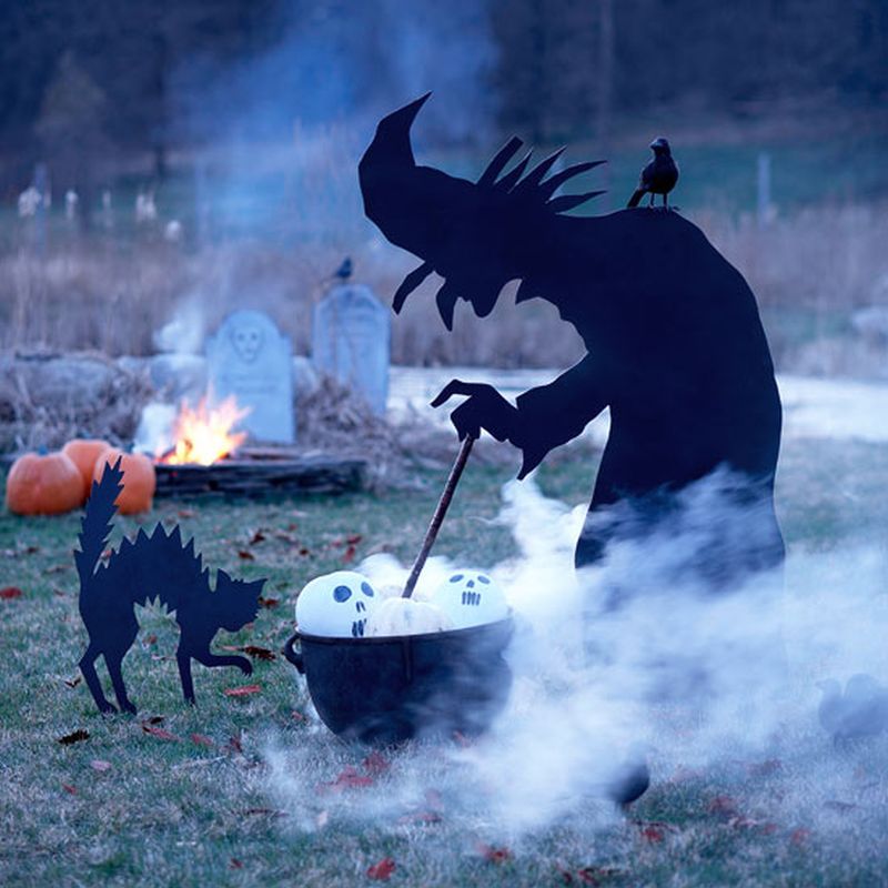 Outdoor Halloween decoration with witch silhouette 