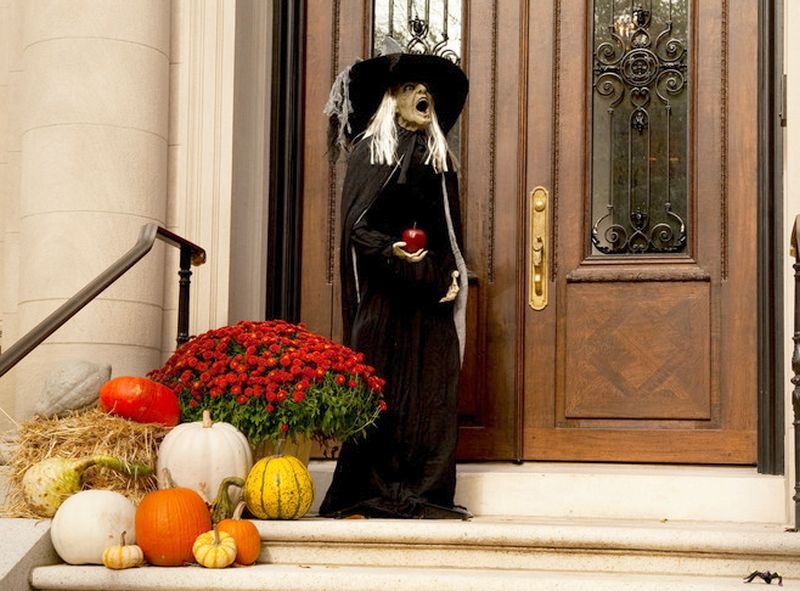 witchy figure for Halloween decor on front door 