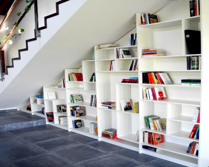 decorate under stair space using books