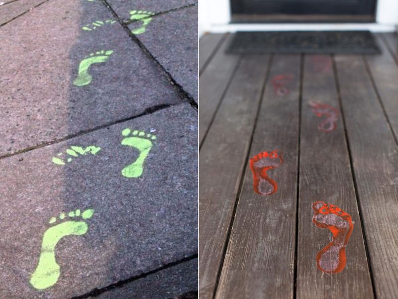 bloody footprints next to front door 