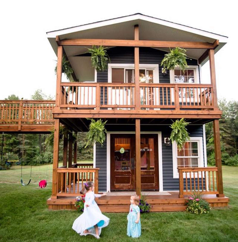 Michigan dad builds two-story playhouse complete with climbing wall and slide