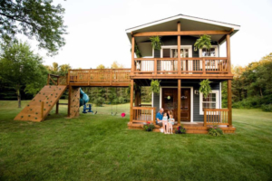 Michigan dad builds two-story playhouse complete with climbing wall and slide