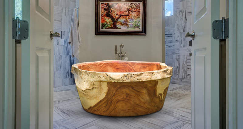 Wood bathtubs by Timber Neutral are carved out of 3 ton tree trunks