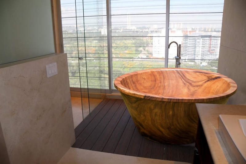 Wood bathtubs by Timber Neutral are carved out of 3 ton tree trunks