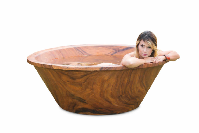 Wood bathtubs by Timber Neutral are carved out of 3 ton tree trunks