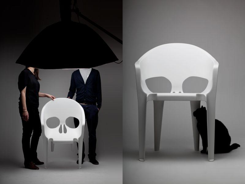 White fiberglass skull chair by pool