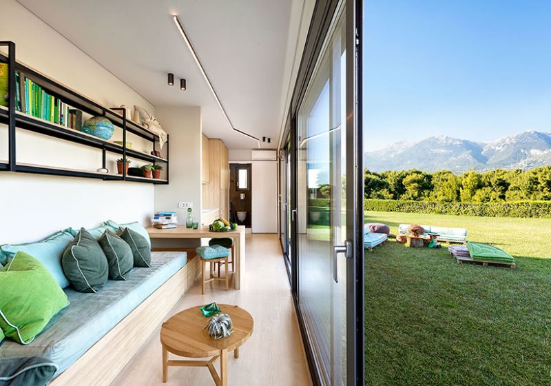 Modular shipping container home by Cocoon Modules featuring large glass windows 