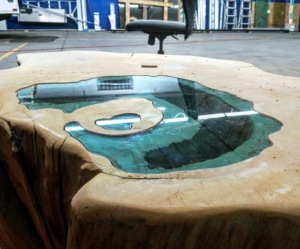 Man builds lake coffee table from a 400-year-old tree trunk