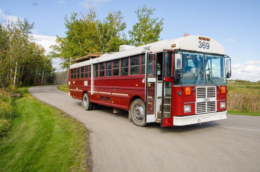 Red Thomas School Bus Converted into a RV by Paved To Pines