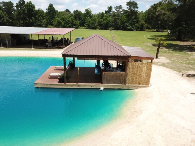 Zydeco Construction Builds Swimming Pond with Beach in Your Backyard
