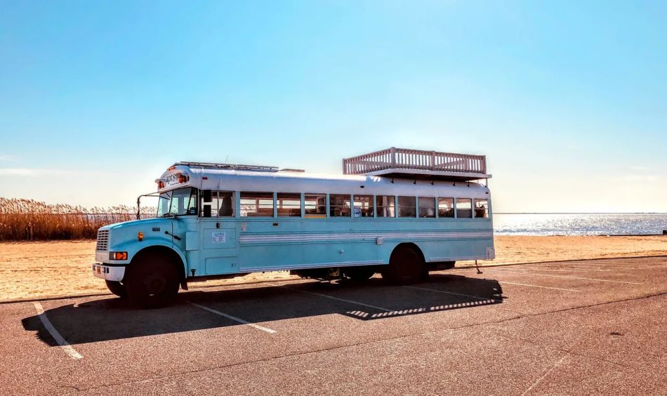 Apt84 School bus conversion with rooftop deck 