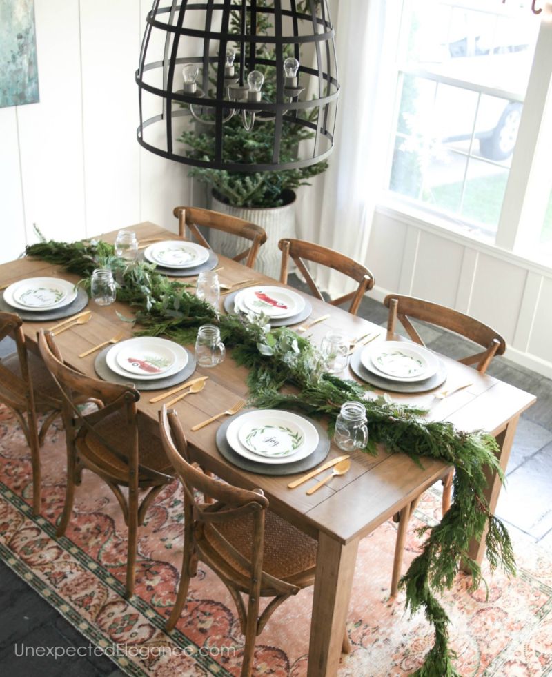 leftover garland in the center of the table with mason jars 