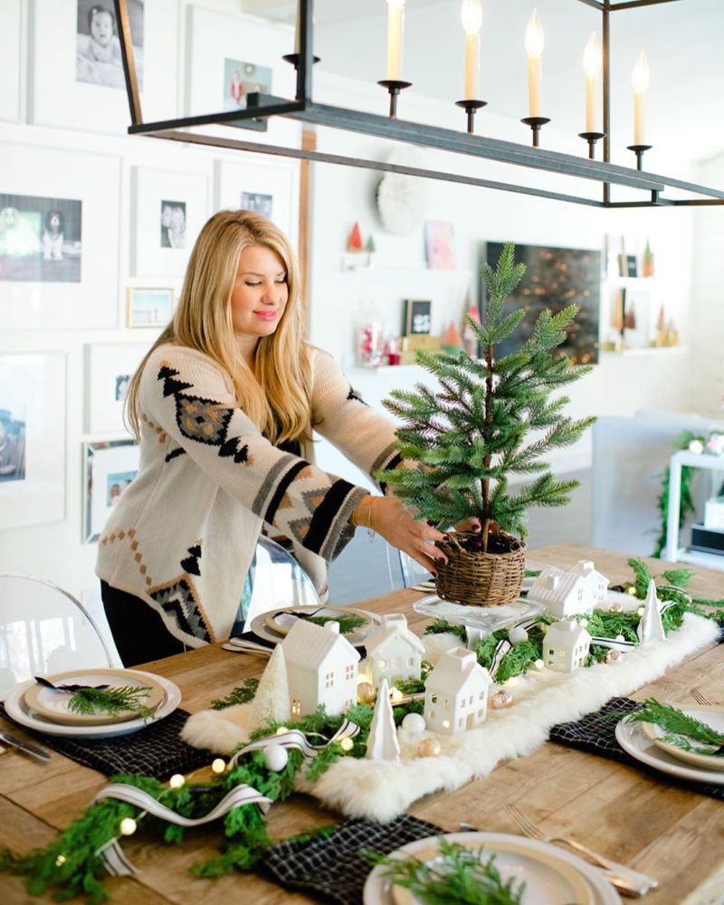 Christmas village on Dining Table with green centerpiece    