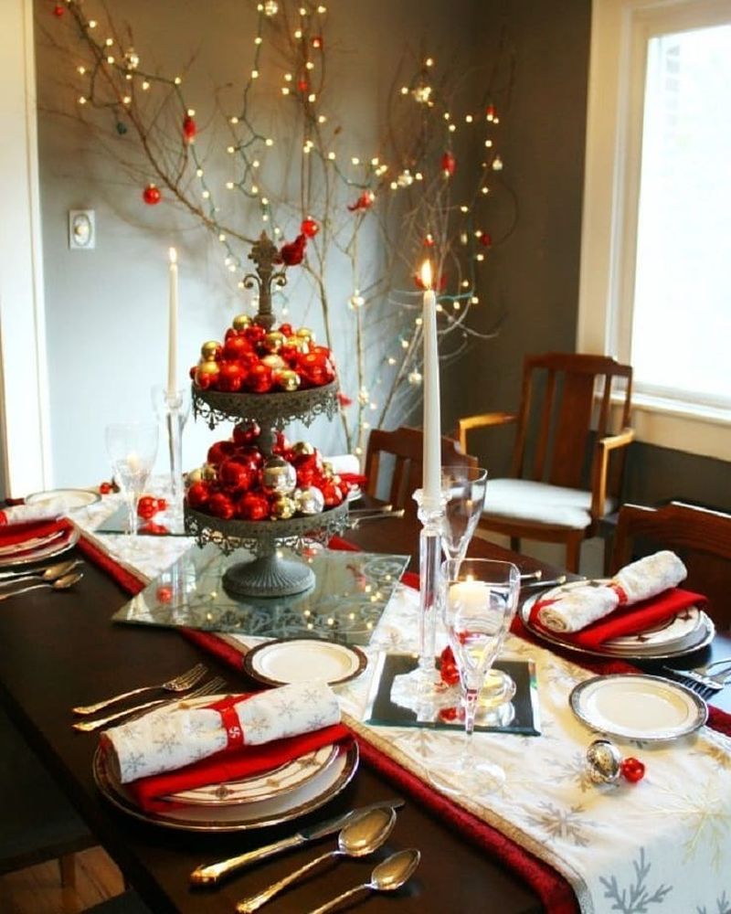 Red and white Christmas dining table with bauble centerpiece