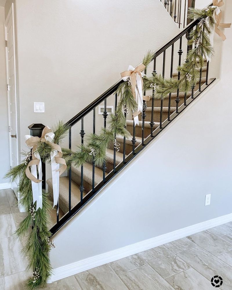 White ribbon, burlap and garland for Christmas stair decor