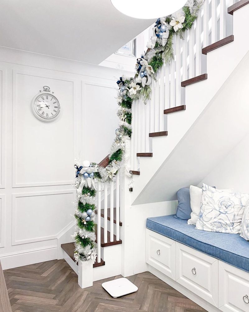 White and green garland with white flowers and ornaments 